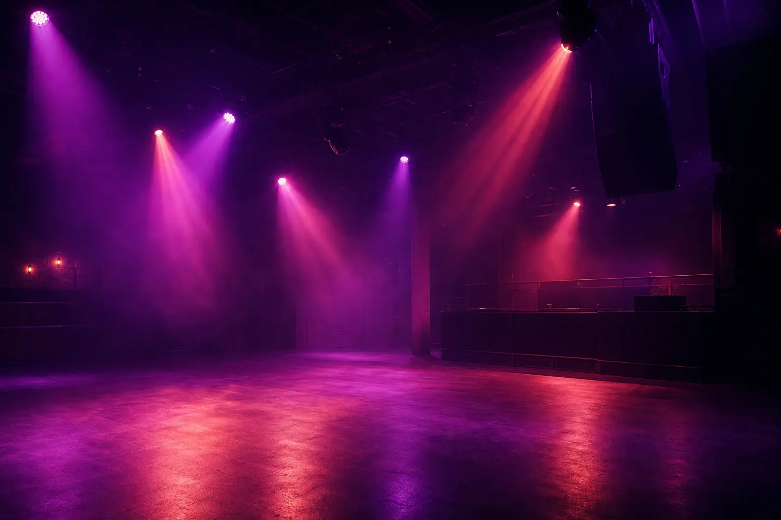 A dark club interior washed in violet light